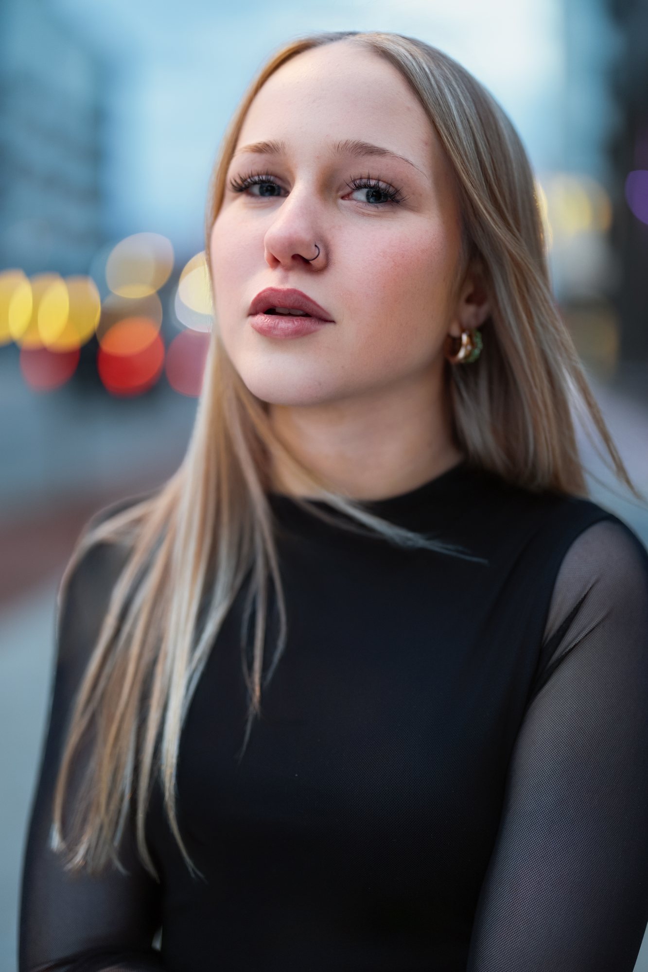 Senior girl in a black turtleneck against city bokeh — senior portraits, South Bend, Indiana