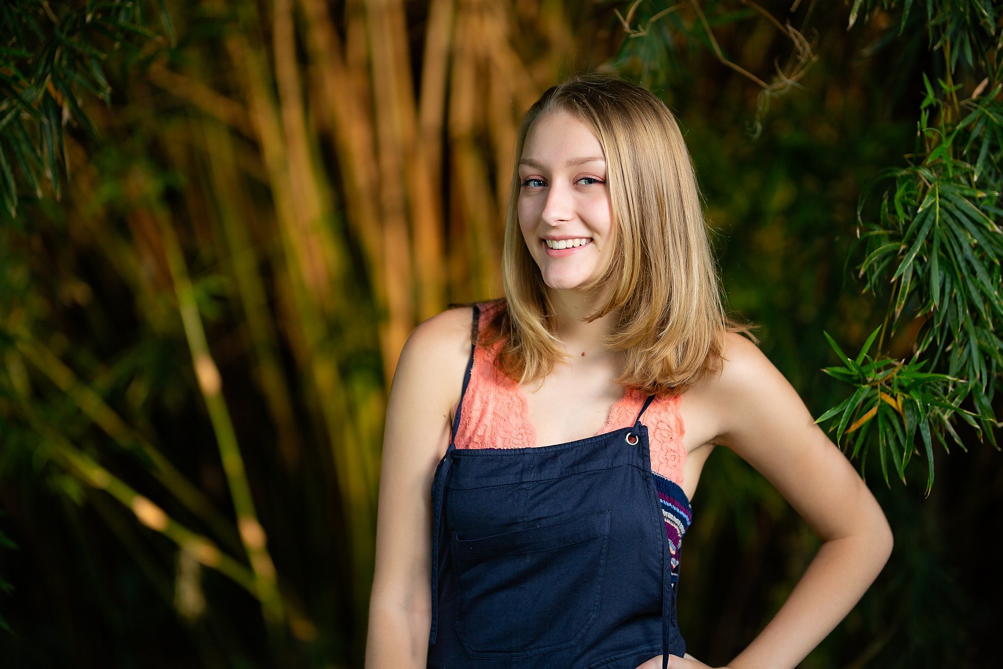 Senior girl in a navy and coral top among bamboo — senior portraits, Granger, Indiana