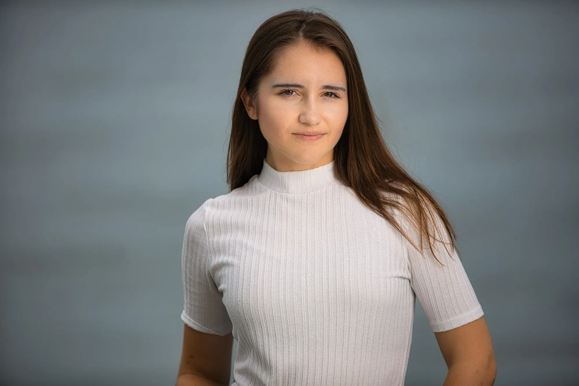 South Bend senior girl in a white mock-neck top posed against a clean studio backdrop