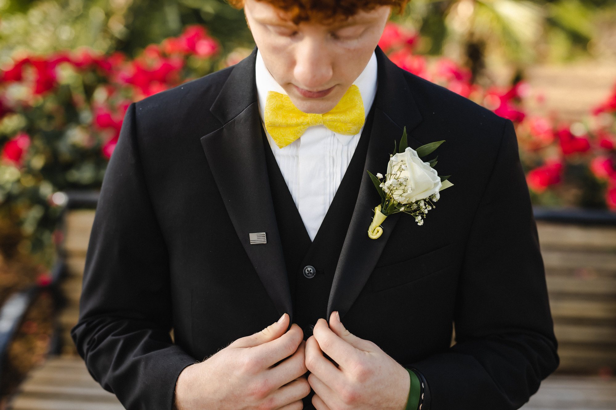 Senior guy in a black tux with a yellow bow tie and boutonniere — South Bend, Indiana